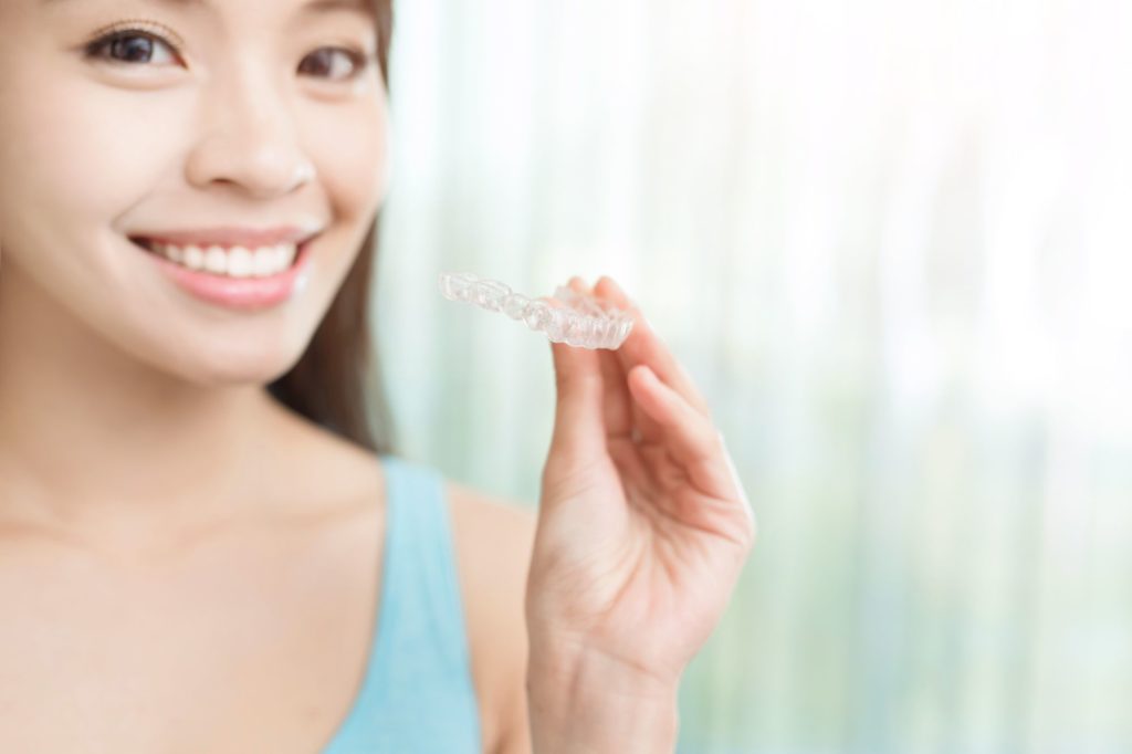 Smiling patient considering Invisalign in Salisbury, MD